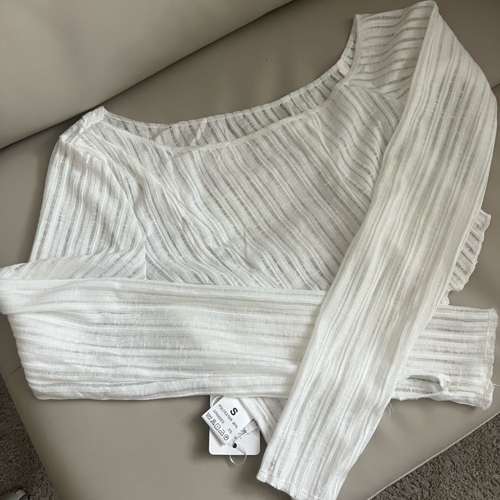 Long sleeve off shoulder asymmetrical hem crop top